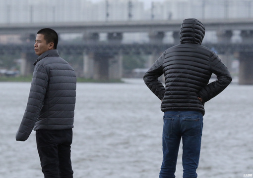 哈尔滨温度最低9℃ 羽绒服重返街头 第1页